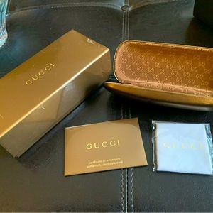 Gucci eyeglass and sunglasses cases.